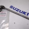 25510-15000 Shift shaft (left and right shift) Suzuki T/GT500 Used but perf.cond.